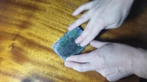 Cleaning a soviet coin Stock Footage 255449812
