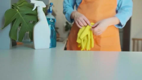 Cleaning specialist prepares for work and picks up a box with necessary supplies Stock Footage 301867956