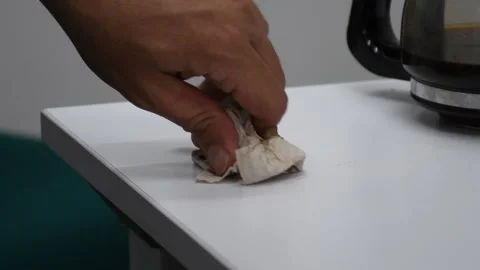 Cleaning spilled coffee from a table with a cloth, wiping liquid mess, coffee Stock Footage 305778837