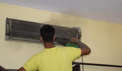 Cleaning Split AC Stock Photos