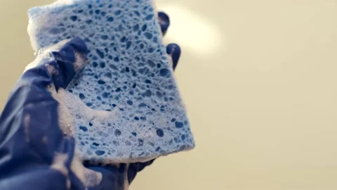 Cleaning sponge and a white Stock Footage 166997622