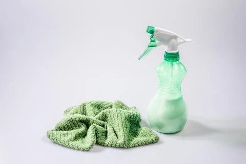 Cleaning with spray detergent, rubber gloves and dish cloth on work surface c Stock Photos