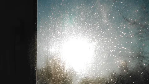 The cleaning spray falls on the surface of the glass Stock Footage 129166904