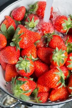 Cleaning Strawberries Stock Photos