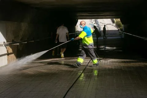 Cleaning the street during confinement. Stock Photos