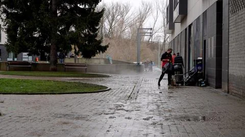Cleaning the streets and storage rooms after flooding of the Arga river Stock Photos