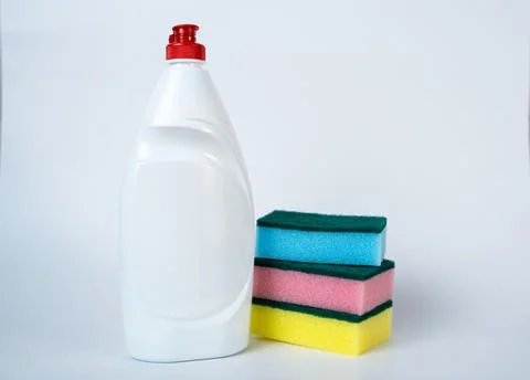 Cleaning Supplies Set. Plastic Detergent Bottle with Colorful Sponges on White Stock Photos