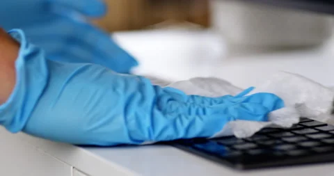 Cleaning surface of desk and computer keyboard Video stock 167666617