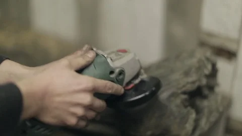 Cleaning the Surface of a Log with a Wire Brush Stock Footage 70304627