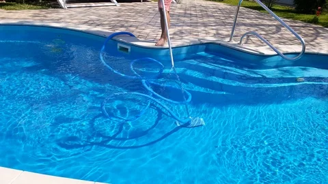 Cleaning  swimming pool. Service and maintenance of the pool. Stock Footage 106995953