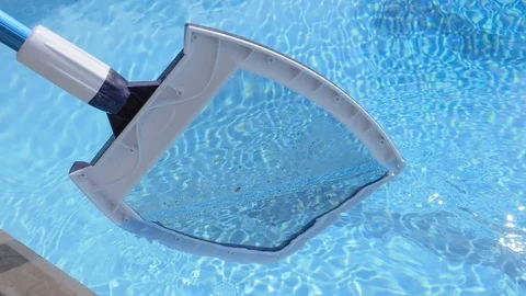 Cleaning a Swimming Pool with a Skimmer Net in Slow Motion Stock Footage 114635486