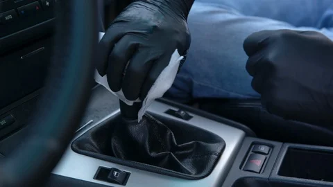 Cleaning the switch with a damp cloth. Car interior cleaning. Stockbeeldmateriaal 114971555