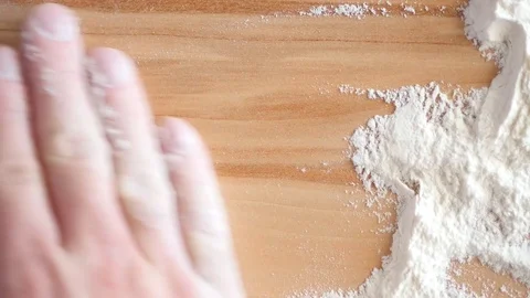Cleaning table from flour with hand Stock Footage 88411847