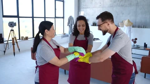 Cleaning team making stack of hands Stock Footage 279495392