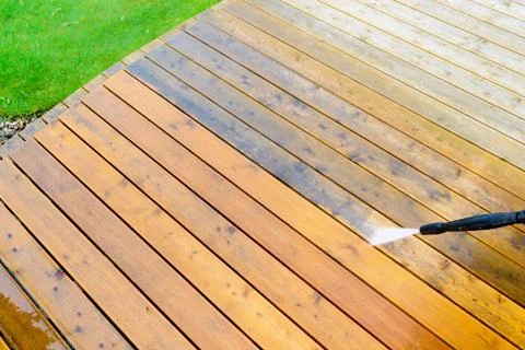 Cleaning terrace with a pressure washer Stock Photos