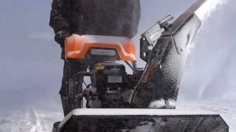 Cleaning of the territory with a snow removal machine. Video stock 87428297