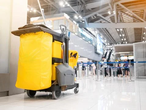 Cleaning tools cart cleaner in the airport. Bucket and set of cleaning equipm Stock Photos