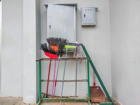Cleaning tools near the electrical panel box Stock Photos