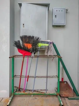 Cleaning tools near the electrical panel box Stock Photos
