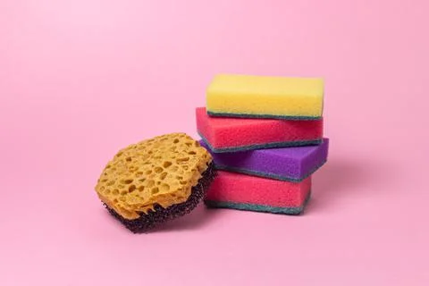 Cleaning tools on a pink background. Indoor cleaning tools. Stock Photos