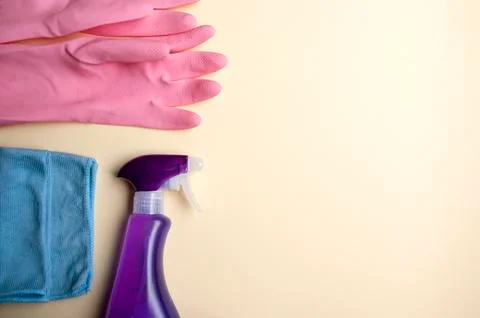 Cleaning tools. Top view detergent spray bottle, fabric, rubber gloves. Bathr Stock Photos