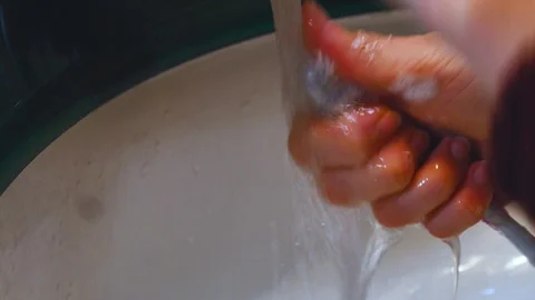 Cleaning the toothbrush Stock Footage 107773399