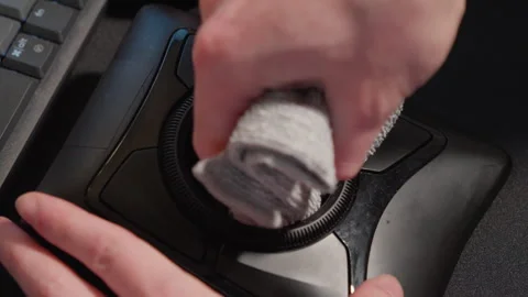 Cleaning a Trackball regularly is advised to ensure smooth cursor movement Stock Footage 323387133