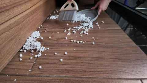 Cleaning Trash from the floor, sweeping garbage with a brush into a dustpan Stock Footage 329936618