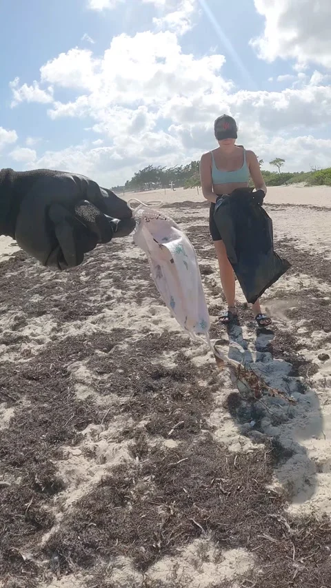 Cleaning trash from public beach in Mexico. Contributing to better world Stock Footage 233428557
