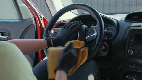 Cleaning the vehicle interior with a microfiber cloth that cleans the interior Stock Footage 159645522