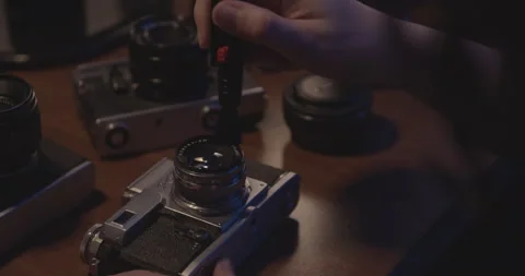 Cleaning Vintage Camera Lens Stock Footage 256592257