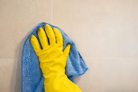 Cleaning wall with blue cloth Stock Photos