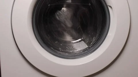 Cleaning the washing machine drum. Close-up of spinning inside Stock Footage 287702881