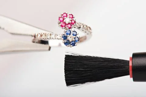 Cleaning white gold ring Stock Photos