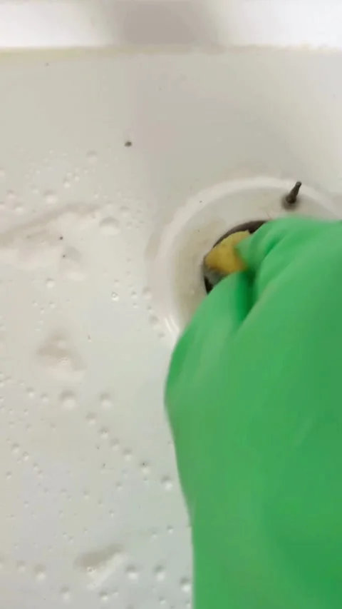 Cleaning a white stove top with sponge and soap Video stock 331976429