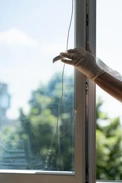 Cleaning a window Stock Photos