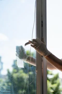 Cleaning a window Stock Photos