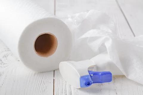 Cleaning window spray with Roll of disposable nonwoven fabric towels Stock Photos