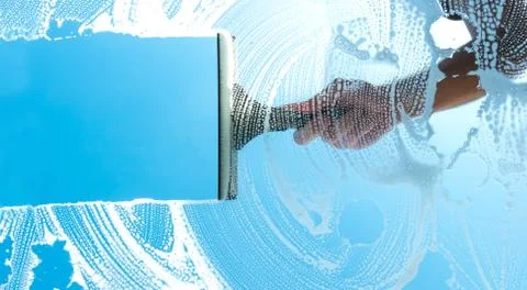 Cleaning window with squeegee blue sky Foto stock