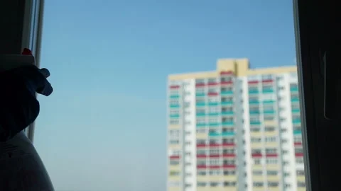Cleaning Window using Cleanser Spray and Squeegee 動画素材 107456617