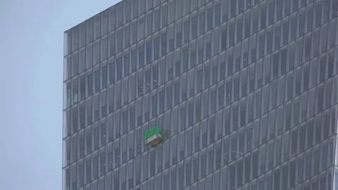 Cleaning windows outside tower in Tel-Aviv - special architecture Stock Footage 137868708
