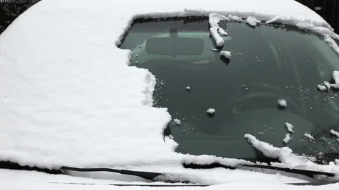 Cleaning the windshield of fresh snow in winter, full HD 1080p time lapse Stock Footage 220284369