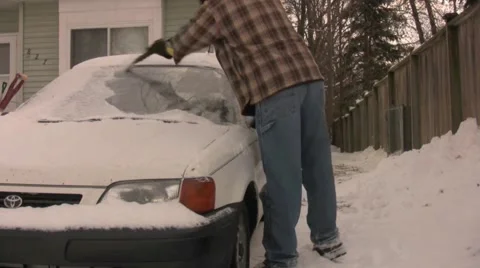 Cleaning Off Winter Stock Footage 1014869
