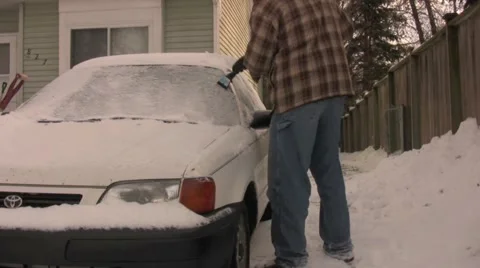 Cleaning Off Winter Stock Footage 1014874
