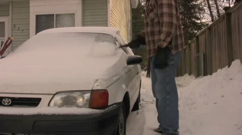 Cleaning Off Winter Stock Footage 1014881