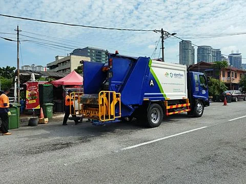 Cleaning workers using heavy vehicles Stock Photos