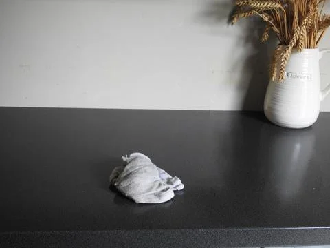 Cleaning a worktop. Stock Photos
