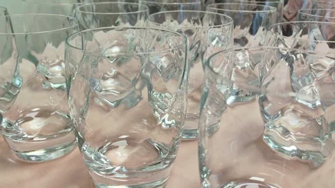 Cleans glass on table. Stock Footage 338418900