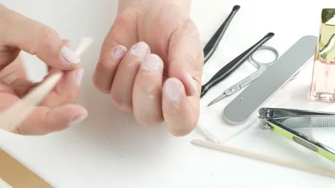 Cleans grime under nails and removes the cuticle of the bamboo stick. Stock-Footage 137296293