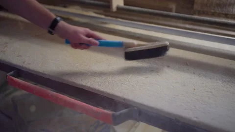 Cleans a workbench with a brush. Cleaning the workplace after work concept. Stock Footage 152400511